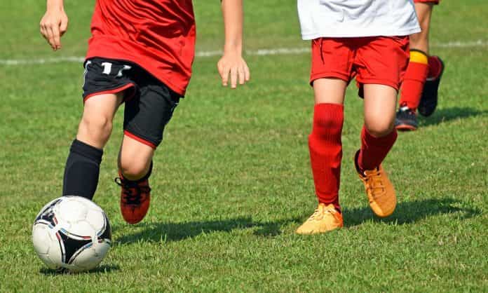 Kids are playing soccer